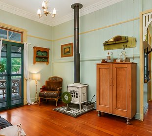 Wisteria living room with timber floors and fireplace